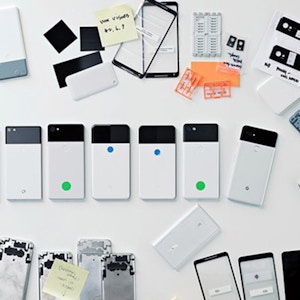 Design process behind the Google Pixel 2016 with pieces of phones laid on the table