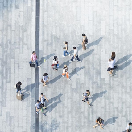 Top view of consumers walking to a mall